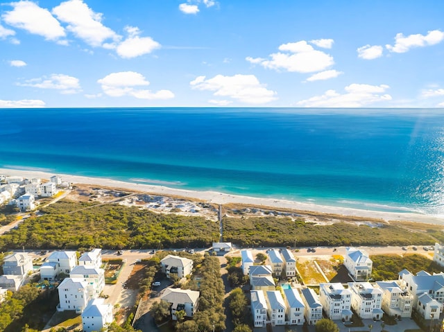 birds eye view of property featuring a water view and a view of the beach