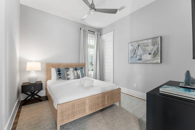 bedroom with ceiling fan and light wood-type flooring