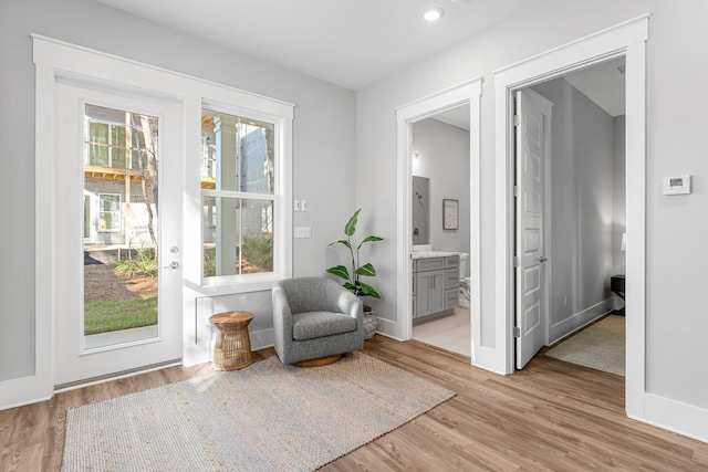 sitting room featuring light hardwood / wood-style floors