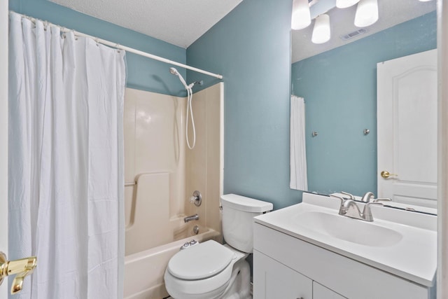 full bathroom with vanity, a textured ceiling, shower / tub combo with curtain, and toilet