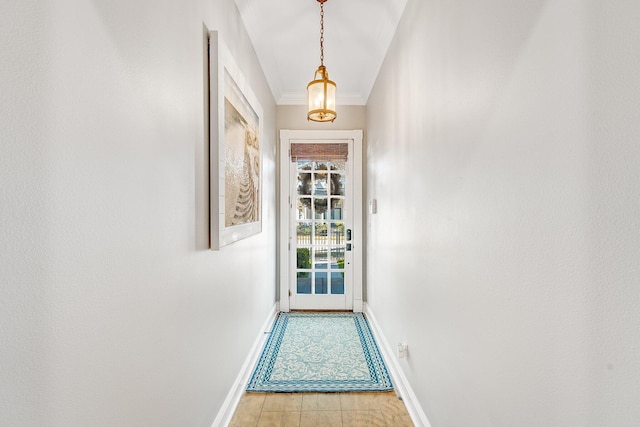 entryway with crown molding and light hardwood / wood-style flooring