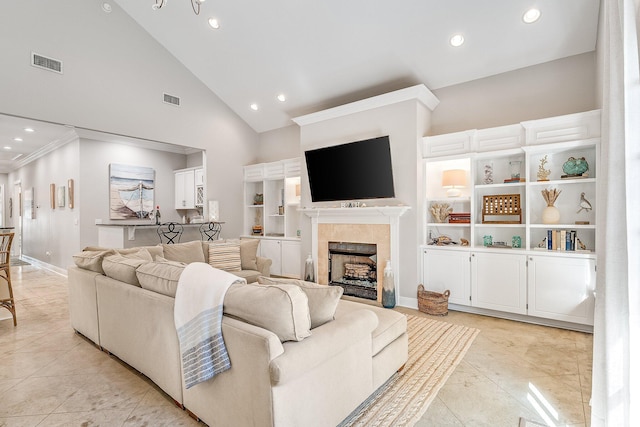 living room featuring high vaulted ceiling and light tile patterned floors