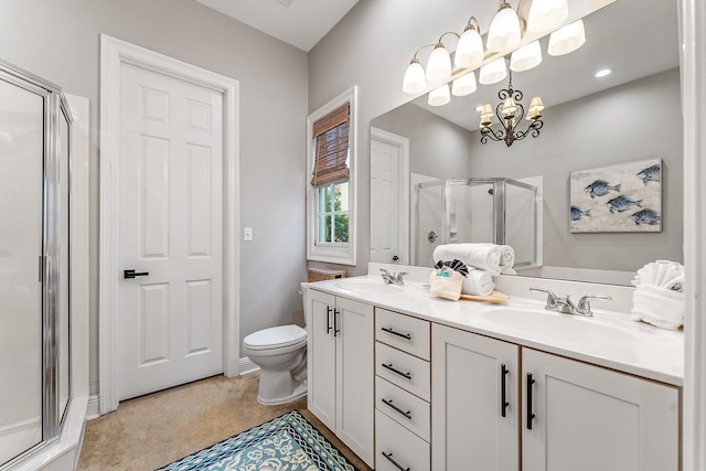 bathroom with toilet, vanity, an enclosed shower, and an inviting chandelier