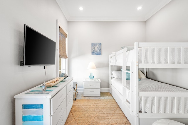 bedroom with light tile patterned floors and ornamental molding