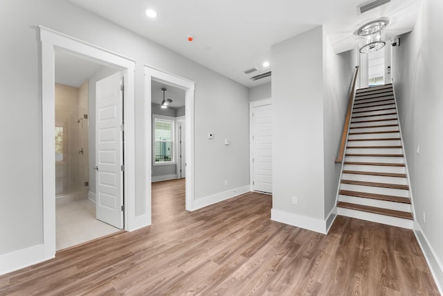 staircase featuring hardwood / wood-style flooring