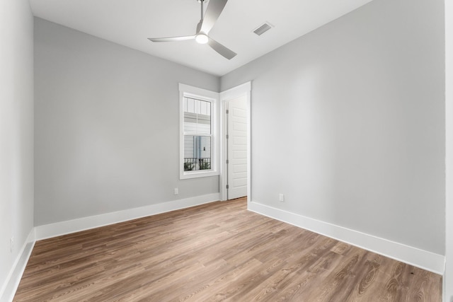 unfurnished room with ceiling fan and light hardwood / wood-style floors