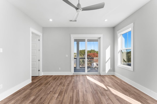 empty room with wood-type flooring and ceiling fan