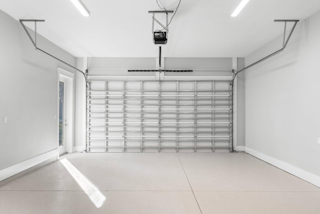 garage featuring a garage door opener