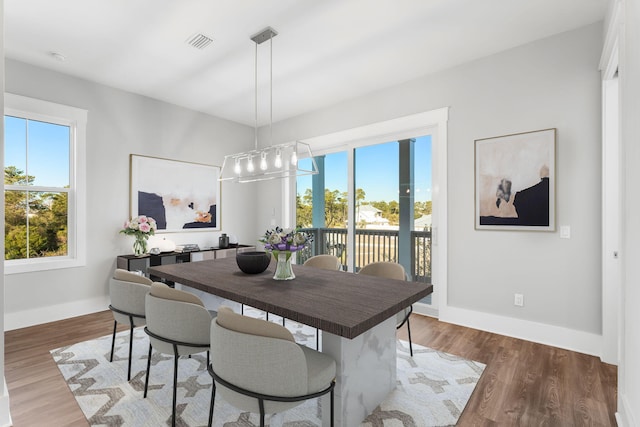 dining room with dark hardwood / wood-style floors