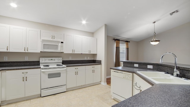 kitchen featuring white appliances, white cabinets, sink, hanging light fixtures, and light tile patterned flooring