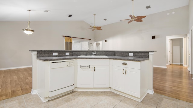 kitchen featuring dishwasher, sink, ceiling fan, an island with sink, and white cabinetry