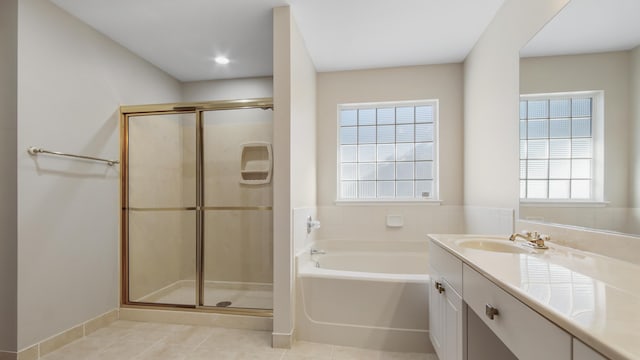 bathroom with tile patterned floors, vanity, and plus walk in shower