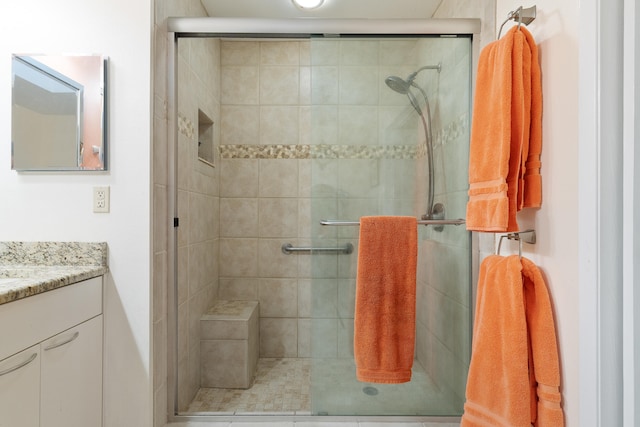 bathroom with vanity and walk in shower