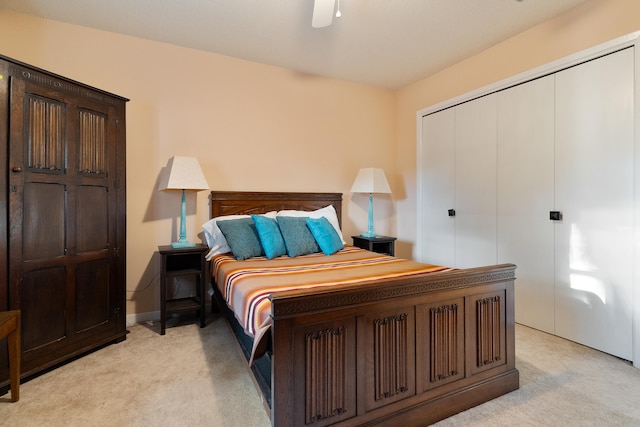 carpeted bedroom with a closet and ceiling fan