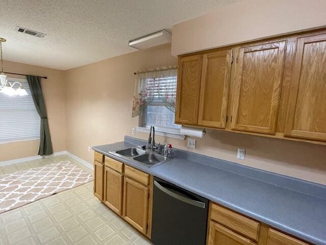 kitchen featuring an inviting chandelier, dishwasher, a textured ceiling, pendant lighting, and sink