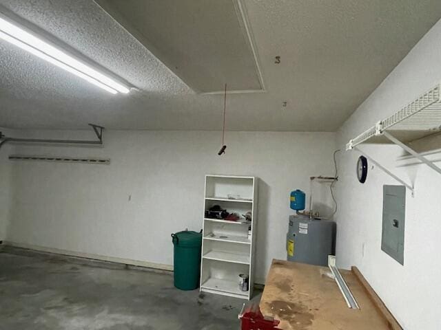 garage with electric panel and water heater