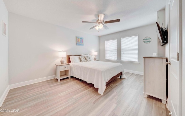 bedroom featuring ceiling fan and light hardwood / wood-style flooring