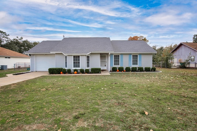 ranch-style home featuring a front yard, central AC, and a garage