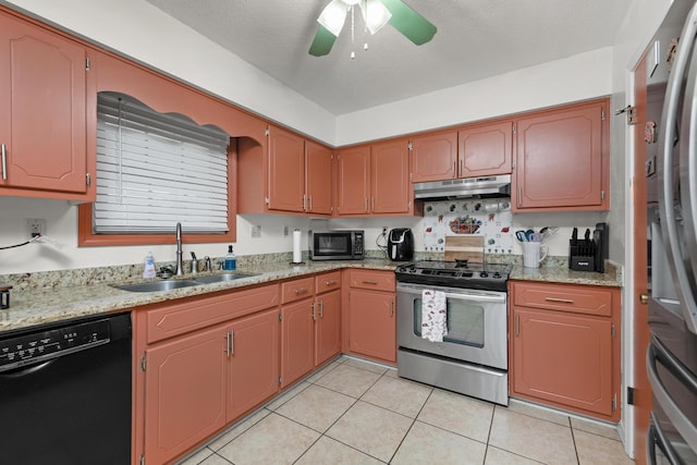 kitchen with sink, ceiling fan, light tile patterned floors, a textured ceiling, and stainless steel appliances