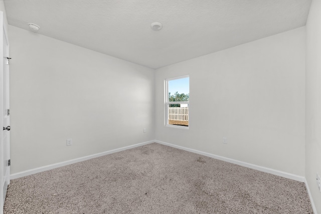 unfurnished room featuring carpet floors