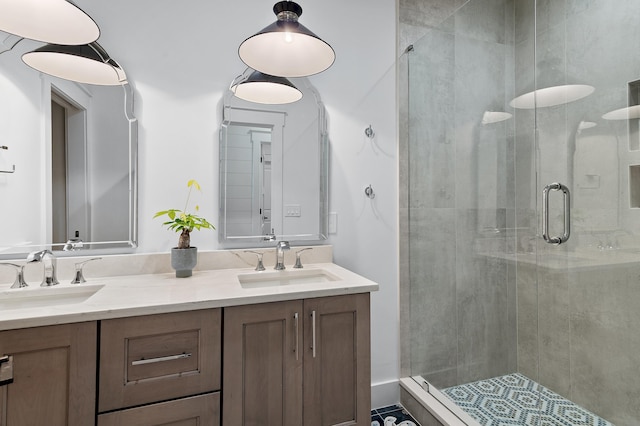 bathroom with walk in shower and vanity