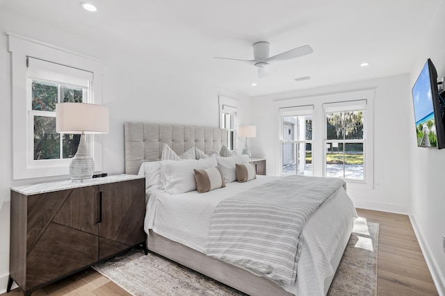 bedroom featuring ceiling fan and light hardwood / wood-style floors