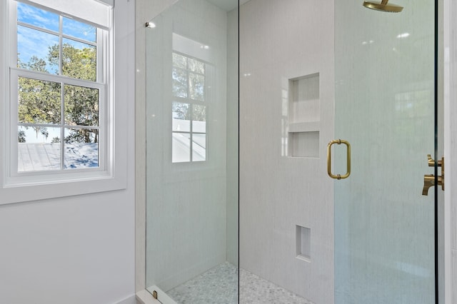 bathroom featuring an enclosed shower