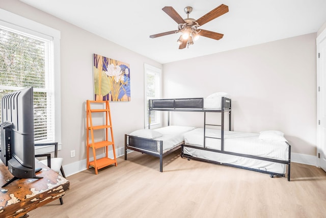 bedroom featuring ceiling fan and light wood-type flooring