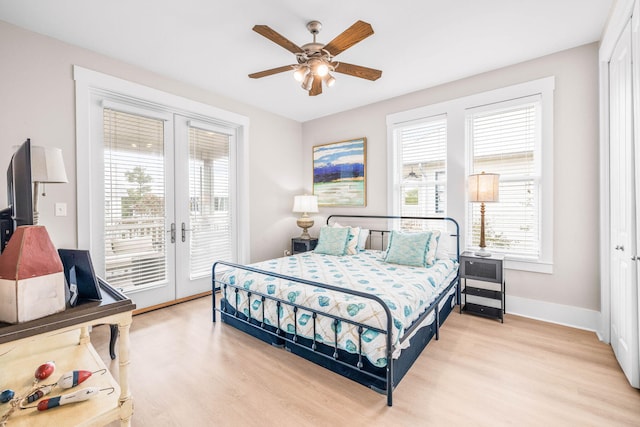 bedroom with ceiling fan, light hardwood / wood-style floors, access to outside, and french doors