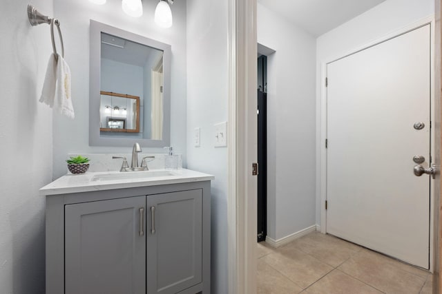 bathroom with tile patterned floors and vanity