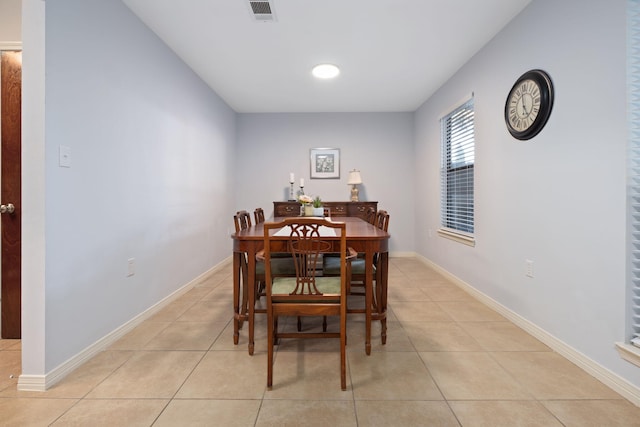 dining space featuring light tile patterned floors