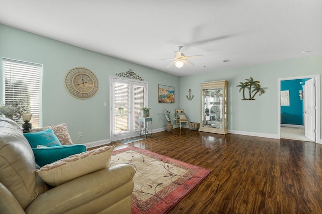 living room featuring ceiling fan and wood-type flooring