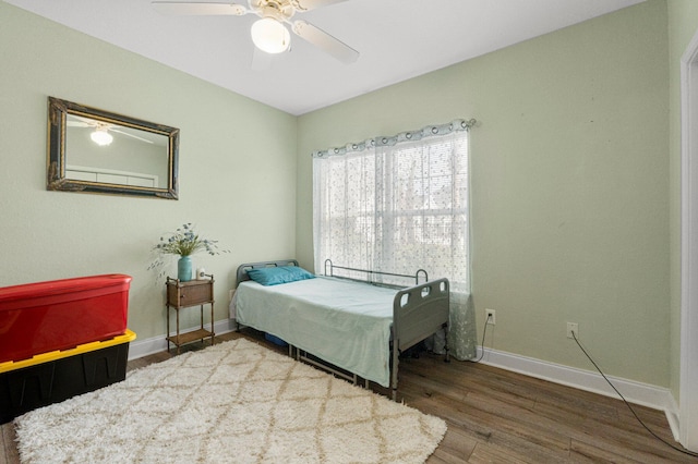 bedroom featuring ceiling fan and wood-type flooring