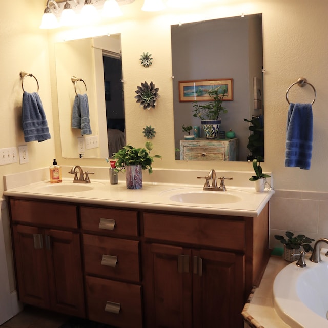 bathroom featuring vanity and a tub to relax in