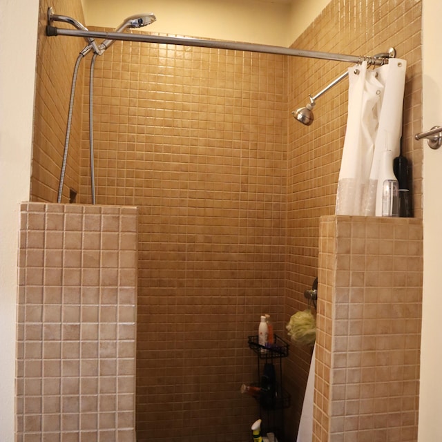 bathroom with tiled shower