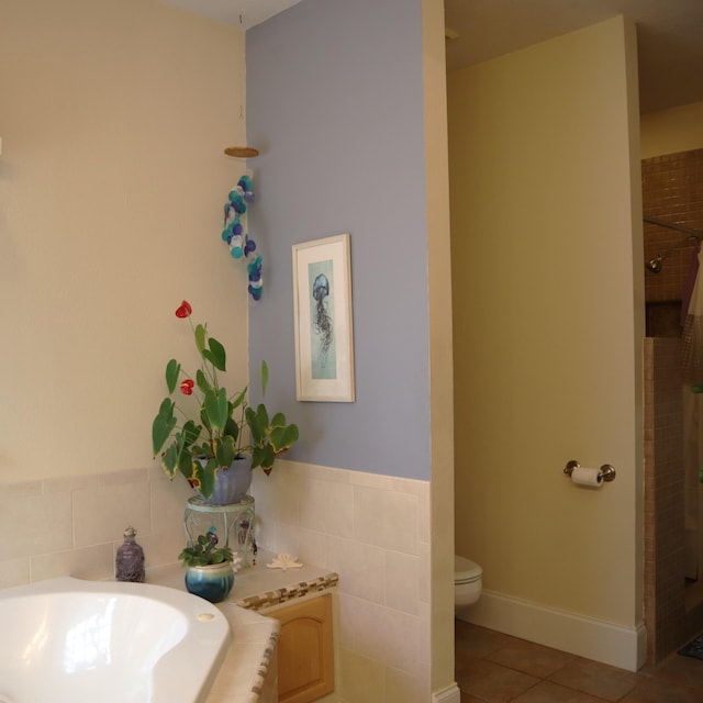 bathroom featuring tile patterned flooring, toilet, and plus walk in shower