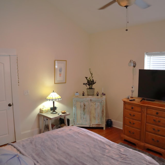 bedroom featuring hardwood / wood-style flooring and ceiling fan