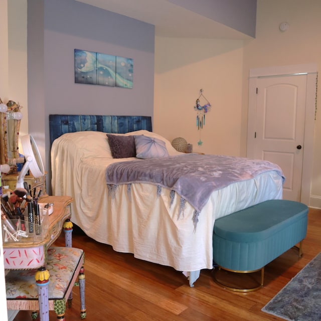 bedroom with hardwood / wood-style flooring