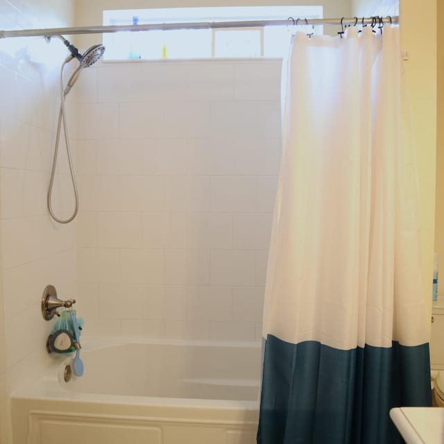 bathroom featuring shower / bath combination with curtain