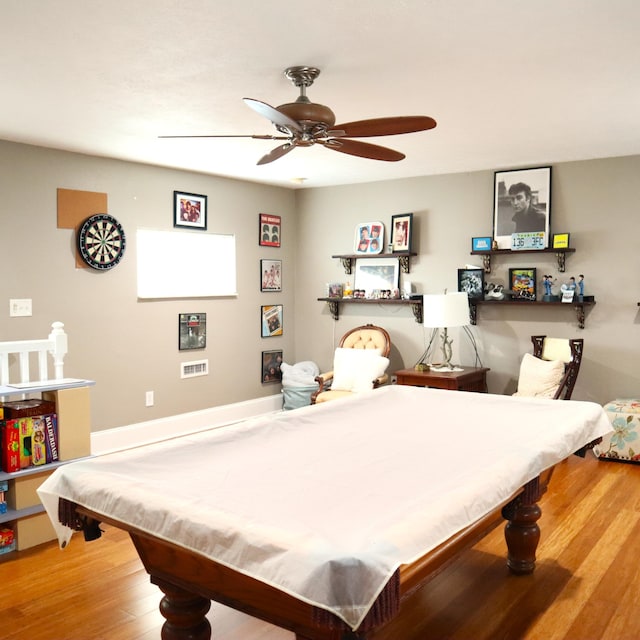 game room with hardwood / wood-style flooring, ceiling fan, and pool table