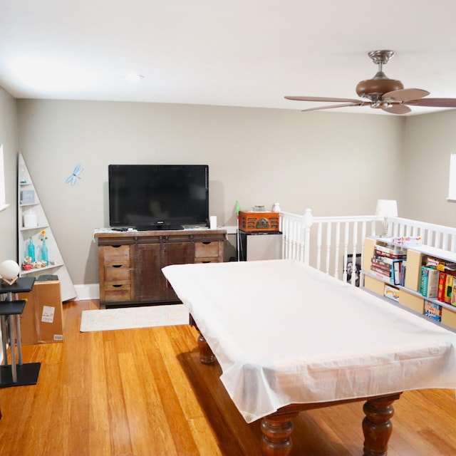 rec room featuring hardwood / wood-style flooring, ceiling fan, and pool table