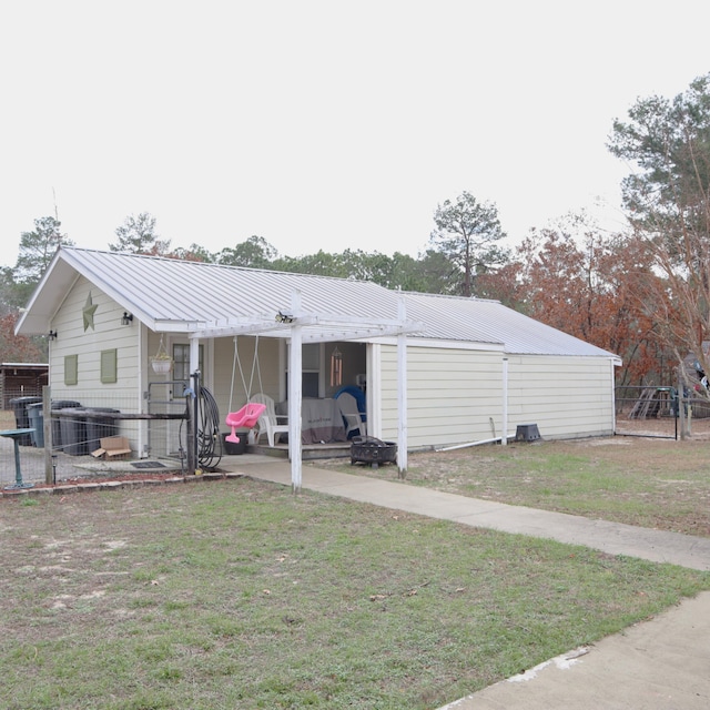 view of outdoor structure with a yard and central air condition unit