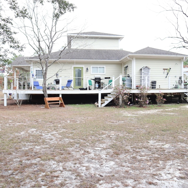 rear view of property with a wooden deck