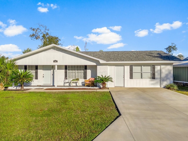 ranch-style home with a porch and a front lawn