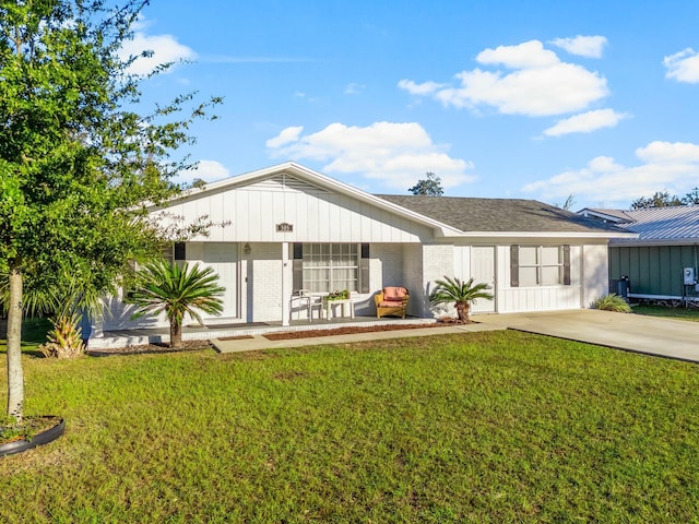 view of front of property with a front yard and covered porch