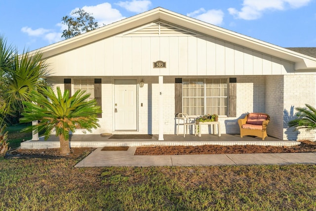 view of exterior entry featuring a porch