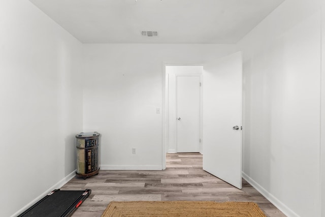 spare room with light hardwood / wood-style flooring