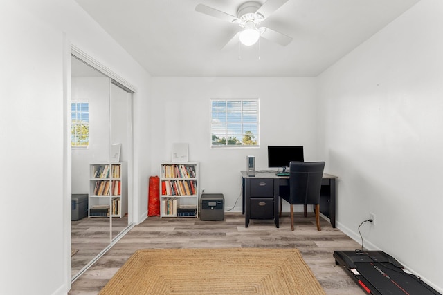 home office featuring hardwood / wood-style flooring and ceiling fan