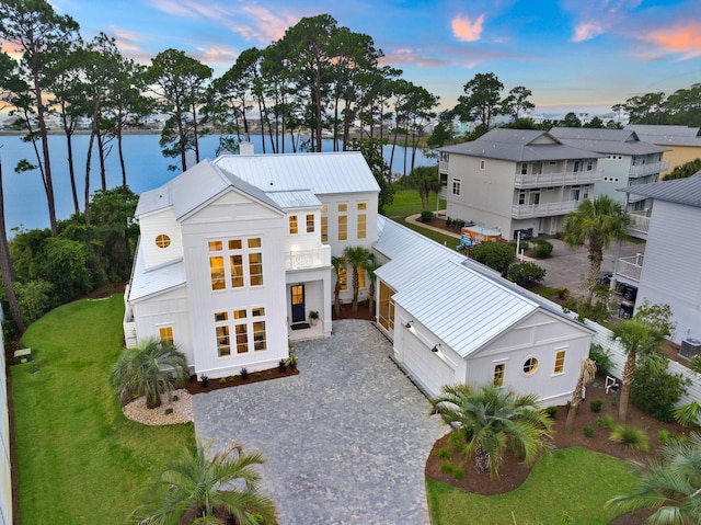 exterior space with a yard and a water view