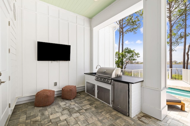 view of patio with an outdoor kitchen and area for grilling